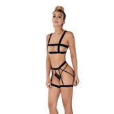 Black lace lingerie set with strappy details and matching thong