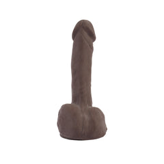 Dildo marrón de aspecto natural con testículos y textura detallada