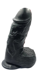 Large black silicone Super Dildo Torpedo with realistic texture and suction cup base