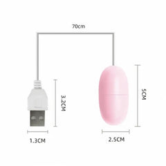 A woman holding the Huevo Vibrador Cory and using the remote control to adjust the vibration intensity, enjoying intimate and pleasurable sensations