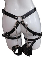 Erotic lingerie accessory set with lace harness garter and matching handcuffs