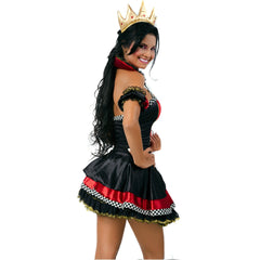 Elegant red gown with a flowing train, adorned with shimmering crystals and worn by a model with a regal demeanor