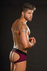 SUSPENSORIO VINO: The wine holder is shown with the bottle at an angle, showcasing the unique design and functionality of this stylish accessory