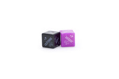 Two red and black dice with suggestive actions and body parts