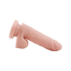 A close-up of a silicone dildo with a lifelike texture and design
