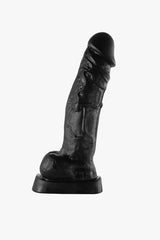 Woman's hand holding the soft and pliable Consolador Evans dildo