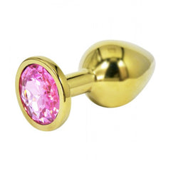 Shiny gold anal plug with jeweled base for luxurious pleasure and visual appeal