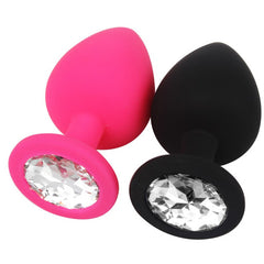 Silicone anal plug in vibrant red color featuring a stunning round jewel for a touch of sophistication
