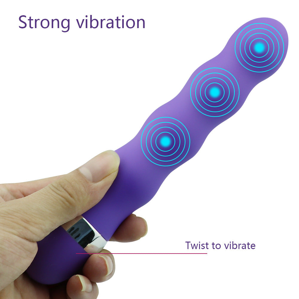 A close-up image of the VIBRADOR CURLY, a flexible and textured vibrating product designed for pleasurable stimulation