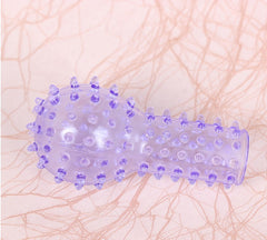 Woman's hand wearing fingerless gloves with geometric point pattern