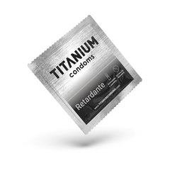 Hand holding a pack of Titanium Retardante condoms with product details