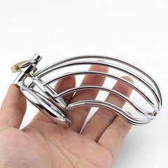 Stainless steel chastity cage with lock and key, the Funda De Castidad Omega, ensures secure and discreet male chastity