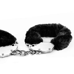 Pair of fluffy handcuffs in baby blue color, perfect for gentle restraint play