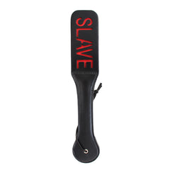 Black leather spanking paddle with 'Bitch' written on it, perfect for BDSM play