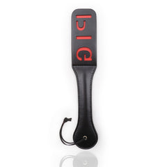 Black leather paddle with 'Bitch' inscription, suitable for playful spanking
