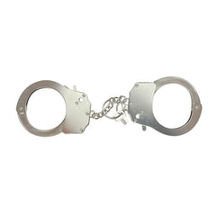 Close-up of man's wrists wearing stylish metal handcuffs