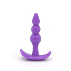Black silicone anal plug with flared base and tapered tip