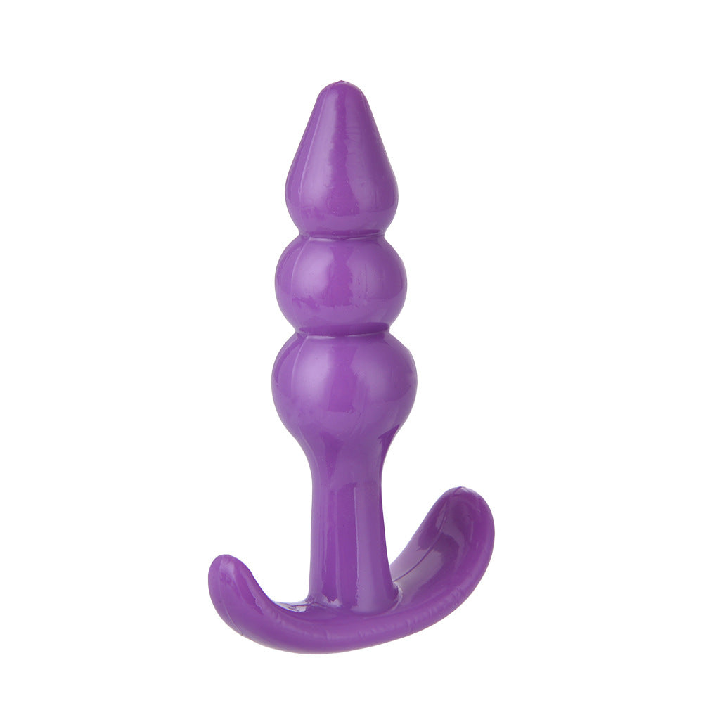 Black silicone anal plug with curved handle, designed for comfortable and pleasurable insertion and wear