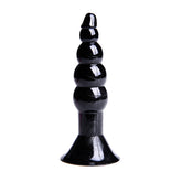 Close-up of black silicone anal plug with Noah's ark themed design on a white background