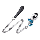 Stainless steel anal plug with chain and gemstone detail for pleasure and stimulation