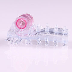 Black silicone vibrator sleeve with textured surface for increased sensation