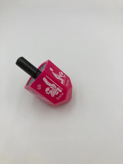 Colorful and exciting Toma Todo Party game with spinning whirligig and dice