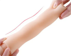 Close-up image of a hand holding a vagina-shaped sex toy for masturbation