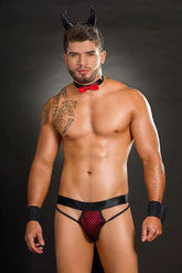 Spicy Diavoletto Picante hot sauce bottle with red chili peppers and garlic on a rustic wooden table