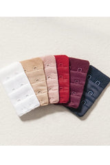Two sets of three bra extenders in different colors for bras