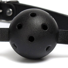 BDSM accessory with ball gag, nipple clamps, and chains