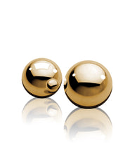 Two golden Ben-Wa balls for pelvic floor strengthening and sensual stimulation