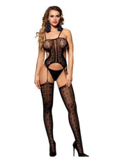 Beautiful woman in black lace bodystocking with high heels posing in a sensual way