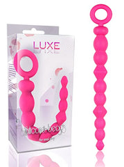 Two hands holding BOLAS LUXE SILICONE BEADS, showcasing the luxurious and high-quality design for enhanced pleasure and satisfaction