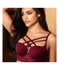 Aleyda lingerie in white lace with delicate floral details and satin bow accents