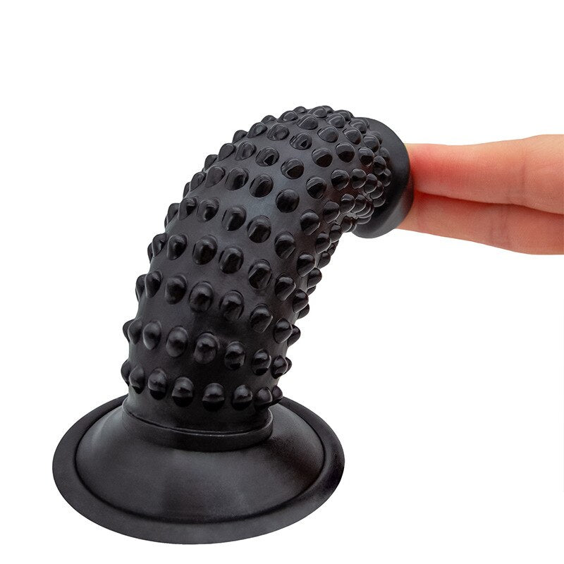 Dildo Texturizado Cob being used in a harness for strap-on play
