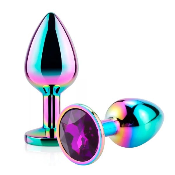  Hand holding Plug Joya Tornasol with sunlight reflecting off its iridescent surface