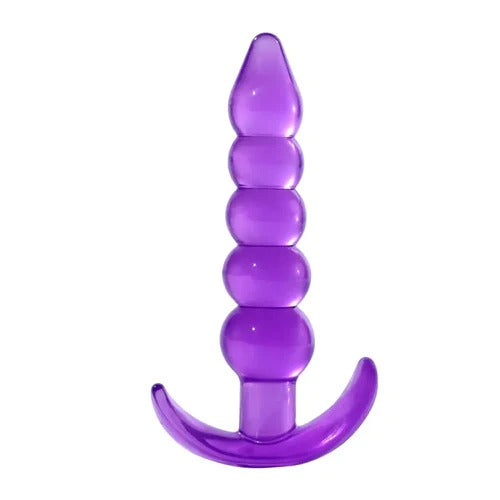 Person using anal plug with long, flexible tail for visual and sensory stimulation