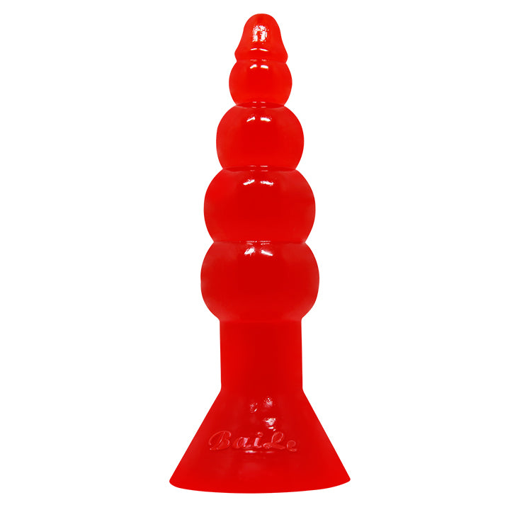 Close-up of PLUG BUTT RIDERS product in pink silicone with tapered tip and flexible material