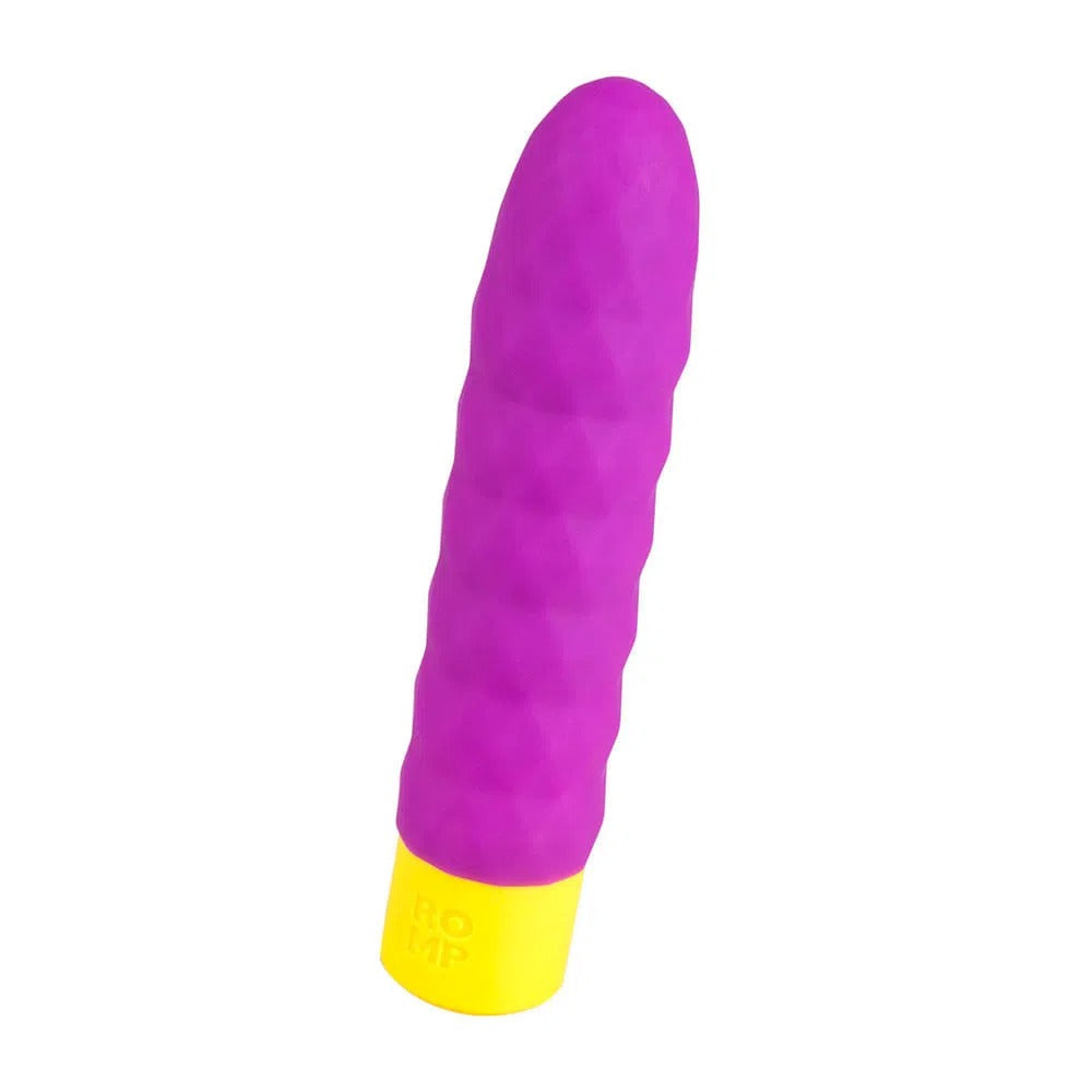 Woman using Romp Beat Bala Vibradora in red color for clitoral stimulation during solo play or foreplay with partner