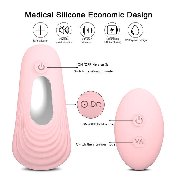  Woman holding remote control vibrator with wing-shaped design