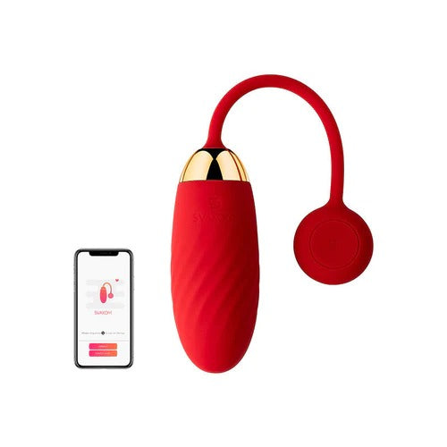 Beautiful woman holding the interactive vibrating bala ella svakom in her hand