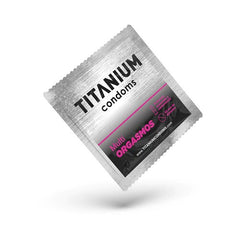 Hand holding a single Condones Titanium Multiorgasmos x 3 condom in its wrapper