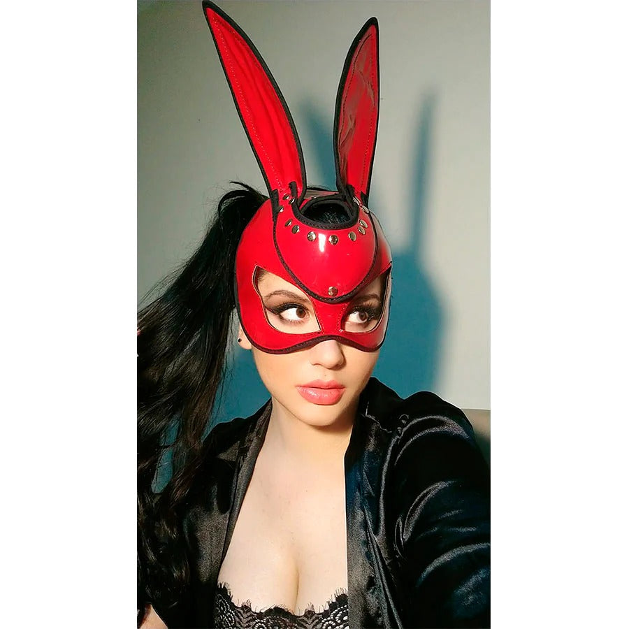 Black face mask with white Bad Bunny logo and adjustable straps