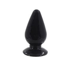 Close-up of hand holding anal plug with tapered tip and slim neck