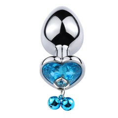  Close-up of elegant and luxurious anal plug with decorative chain and smooth texture