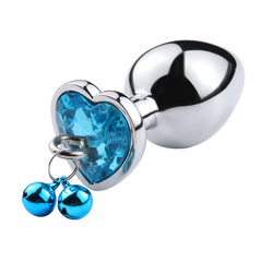  Hand holding stylish and sophisticated anal plug with sparkling chain for intimate play